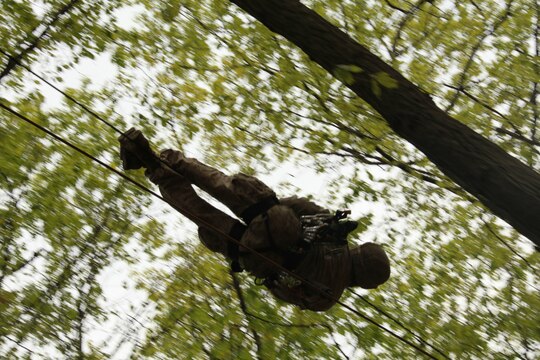 A 26th Marine Expeditionary Unit Marine uses a one-man rope bridge during a class at the Assault Climbers Course at Lower Cliff in Kingwood, W.Va., April 27, 2010.  The Marines crossed between two rock faces using rope tying techniques to get all the Marines, their gear and ropes  to the other side. The Assault Climbers Course is one of several Special Operations Training Group, II Marine Expeditionary Force events as part of 26th MEU's preparation for deployment this fall. (Official USMC photo by Staff Sgt. Danielle M. Bacon) ::r::::n::