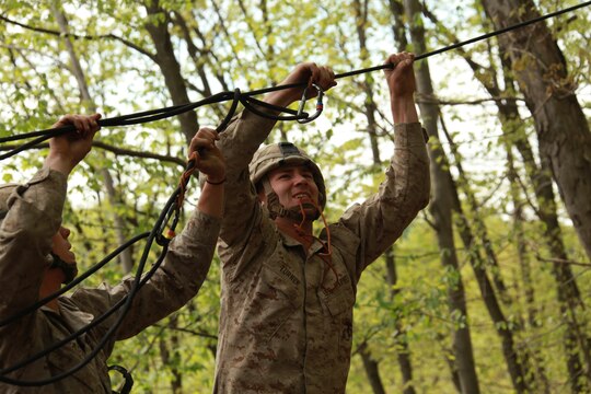 Lance Cpl. Luke Turner, a squad leader with Company K, Battalion Landing Team 3/8, 26th Marine Expeditionary Unit, fixes a melted French prusik knot used to hold tension on a one-man rope bridge during a class at the Assault Climbers Course at Lower Cliff in Kingwood, W.Va. April 27, 2010.  The Marines crossed between two rock faces using rope tying techniques to get all the Marines, their gear and ropes  to the other side. The Assault Climbers Course is one of several Special Operations Training Group, II Marine Expeditionary Force events as part of 26th MEU's preparation for deployment this fall. (Official USMC photo by Staff Sgt. Danielle M. Bacon) ::r::::n::