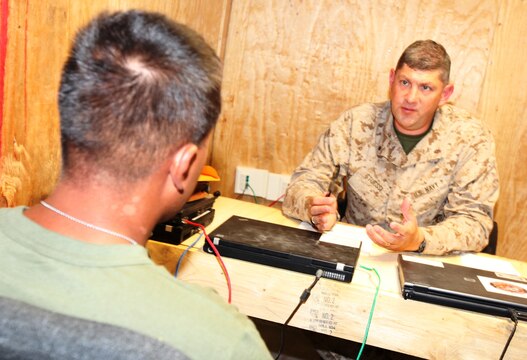 Cmdr. Keith Stuessi, a family physician with Combat Logistics Regiment 15 (Forward), 1st Marine Logistics Group (Forward), consults with a concussion patient at the Concussion Restoration Care Center at Camp Leatherneck, Afghanistan, Aug. 26. The clinic opened Monday and is a first-of-its-kind facility in Helmand Province that was developed to aid in the treatment of concussions