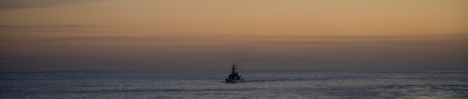 PACIFIC OCEAN -- A Japan Maritime Self Defense Force ship approaches the USS George Washington (CVN 73) in the horizon, Dec. 4. The GW is currently participating in Keen Sword 2011 with the Japanese Self Defense Forces. This exercise enhances the Japan-U.S. alliance which remains a key strategic relationship in the Northeast Asia Pacific region. Keen Sword caps the 50th anniversary of the Japan-U.S. alliance as an "alliance of equals." The exercise runs through Dec. 10. (U.S. Navy photo by Mass Communication Specialist Seaman Cheng S. Yang)