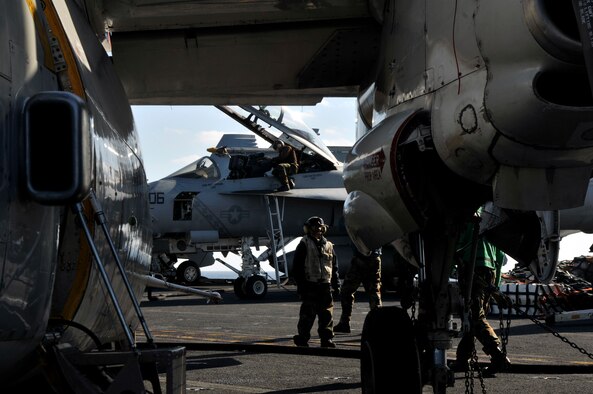 PACIFIC OCEAN -- Sailors aboard USS George Washington (CVN 73) perform last minute checks on aircraft before allowing them to be launched off the ship's flight deck during flight quarters. The GW is currently participating in Keen Sword 2011 with Japanese Self Defense Forces. This exercise enhances the Japan-U.S. alliance which remains a key strategic relationship in the Northeast Asia Pacific region. Keen Sword caps the 50th anniversary of the Japan-U.S. alliance as an "alliance of equals." The exercise runs through Dec. 10. (U.S. Navy photo by Mass Communication Specialist 3rd Class David A. Cox)