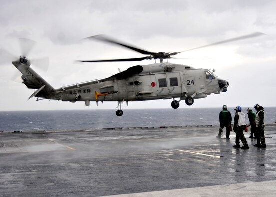 A Japanese Seahawk from the Maritime Self-Defense Force (JMSDF) lands on the flight deck aboard USS George Washington (CVN 73) during a scheduled visit. GW is currently participating in Keen Sword 2011 with the JMSDF. This exercise enhances the Japan-U.S. alliance which remains a key strategic relationship in the Northeast Asia Pacific region. Keen Sword caps the 50th anniversary of the Japan-U.S. alliance as an "alliance of equals." The exercise runs through Dec. 10. (U.S. Navy photo by Mass Communication Specialist 3rd Class David A. Cox)

