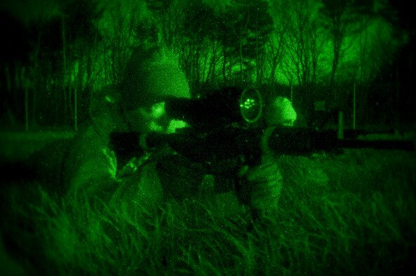 A U.S. Security Forces Airman, operating as an exercise aggressor, takes aim in a field, Dec. 4, 2010, during a bilateral exercise at Misawa Air Base, Japan. The exercise brought together members of the Japan Ground Self-Defense Force, Japan Air Self Defense Force, and the U.S. Air Force to practice defending the base against potential threats such as unauthorized entries, improvised explosive devices, surveillance and probing by adversaries. (U.S. Air Force photo by Senior Airman Jessica Lockoski)