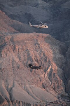 A CH-53E Super Stallion with the Marine Heavy Helicopter Squadron 361 (Reduced) (Reinforced) “Flying Tigers” returns to Forward Operating Base Jalalabad, Afghanistan to deliver a disabled H-47 Chinook for repairs Dec. 10.  The Flying Tigers, based out of Camp Bastion, flew across the country to conduct the mission.  Their Super Stallions are the only aircraft in country capable of a 23,500 pound external lift.