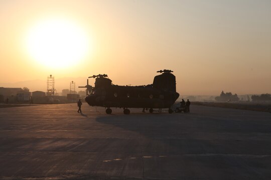 A disabled H-47 Chinook rests on the Forward Operating Base Jalalabad, Afghanistan, flightline Dec. 10, after being delivered by a CH-53E Super Stallion with the Marine Heavy Helicopter Squadron 361 (Reduced) (Reinforced) “Flying Tigers.”  The Flying Tigers, based out of Camp Bastion, flew across the country to conduct the mission.  Their Super Stallions are the only available aircraft in country capable of a 23,500-pound external lift.
