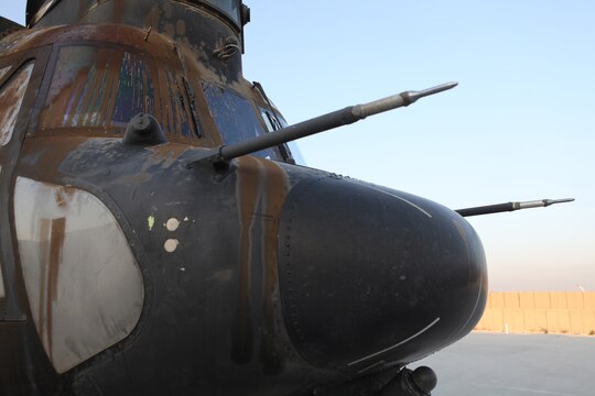 A disabled H-47 Chinook rests on the Forward Operating Base Jalalabad, Afghanistan, flightline Dec. 10, after being delivered by a CH-53E Super Stallion with the Marine Heavy Helicopter Squadron 361 (Reduced) (Reinforced) “Flying Tigers.”  The Flying Tigers, based out of Camp Bastion, flew across the country to conduct the mission.  Their Super Stallions are the only available aircraft in country capable of a 23,500-pound external lift.