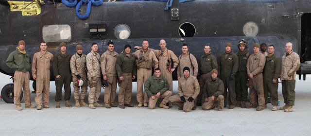 The 3rd Marine Aircraft Wing (Forward) commanding general and sergeant major stand with Lt. Col. Douglas Gasgow, commanding officer for the Marine Heavy Helicopter Squadron 361 (Reduced) (Reinforced) “Flying Tigers,” and a small group of his Marines in front of a disabled H-47 Chinook.  The Marines conducted an external lift for the Chinook, returning the aircraft for repairs to Forward Operating Base Jalalabad, Afghanistan.  The Tigers and their CH-53E Super Stallions are the only aircraft in country capable of a 23,500 pound external lift.