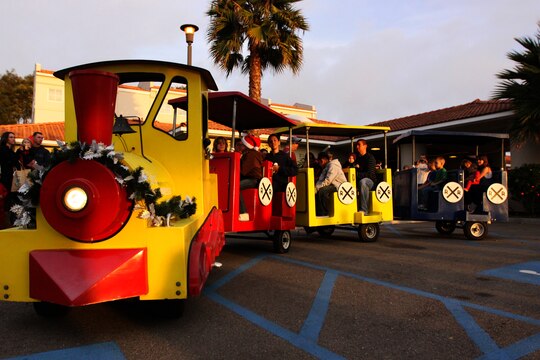Marines, sailors and their families ride on a holiday express train during the annual Winter Wonderland Festival at Camp Pendleton’s Abby Reinke Center, Dec. 15. During the event, guests took photos with Santa Claus and Rudolph the red-nose reindeer, danced with the Gingerbread Man, enjoyed free snacks, played games to win prizes and got nutritional education while socializing.