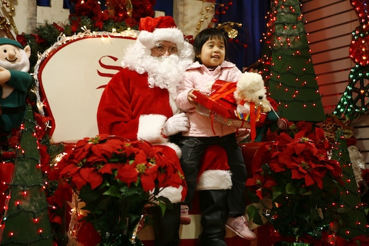 2nd Lt. Richard K. Grainger, Headquarters and Headquarters Squadron crew officer, joined in the holiday spirit and volunteered to be Santa Claus for the 6th annual Marine Corps Exchange angel tree gift exchange at the MCX here Dec. 18.