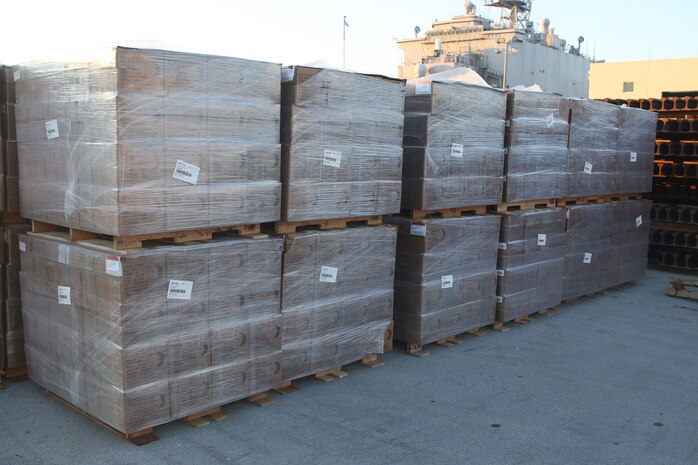 Pallets of meals-ready-to-east sit on the pier at Morehead City, N.C. awaiting to be loaded onto the amphibioius assault ships USS Bataan, Carter Hall and Fort McHenry, Jan. 15, 2009.  The 22nd Marine Expeditionary Unit will deploy to the earthquake-ravaged Caribbean nation of Haiti to conduct sea-based humanitarian assisstance and disaster relief.