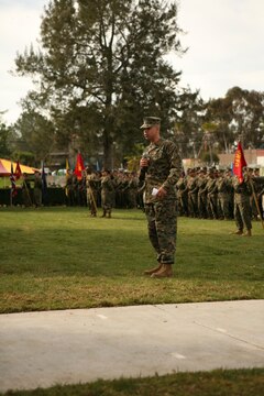 Sgt. Maj. Antonio N. Vizcarrondo Jr. speaks to Marines and sailors of the 1st Marine Logistics Group during his acceptance speech after being appointed 1st MLG Sergeant Major.