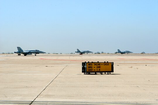 F/A-18 "Hornets" line up on the runway in preparation for take off from Marine Corps Air Station Miramar's flight line June 25. More than 20 aircraft from MCAS Yuma, Ariz., Mountain Home Air Force Base, Idaho and Nellis AFB, Nev., participated in the Marine Division Tactics Course and exercise Trident Warrior here.