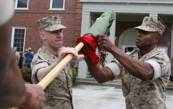 Lt. Col. Eric Davis (left), the commanding officer of Combat Logistics Battalion 46, 2nd Marine Logistics Group, and Sgt. Maj. Derrick Smith (right), the CLB-46 sergeant major, case their unit’s colors during a deactivation ceremony aboard Camp Lejeune, N.C., March 22, 2010.  The all-reserve battalion, which is made up of 900 Marines from 70 reserve sites spanning across 42 states, was activated for the first time in June 2009 to deploy in support of Operation Iraqi Freedom.