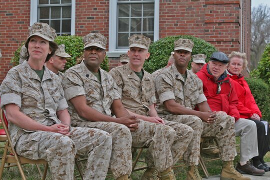 (From left to right) Brig. Gen. Tracy Garrett, the 4th Marine Logistics Group commanding general; Sgt. Maj. Alexander Williams, 4th MLG sergeant major; Lt. Col. Eric Davis, commanding officer of Combat Logistics Battalion 46, 2nd Marine Logistics Group; Sgt. Maj. Derrick Smith, CLB-46 sergeant major; and the parents of Davis, listen to a speech given by Brig. Gen. Juan G. Ayala, the 2nd MLG commanding general, during a deactivation ceremony aboard Camp Lejeune, N.C., March 22, 2010.  The all-reserve battalion, which is made up of 900 Marines from 70 reserve sites spanning across 42 states, was activated for the first time in June 2009 to deploy in support of Operation Iraqi Freedom.