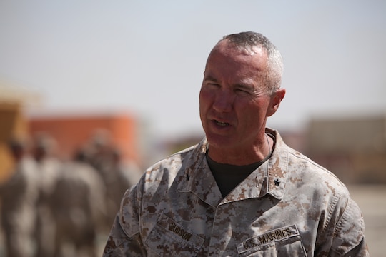Brig. Gen. Charles L. Hudson, commanding general of 1st Marine Logistics Group Forward, speaks to fellow Marines during a Transfer of Authority ceremony at Camp Leatherneck, Afghanistan, March 24, in which 1st MLG assumed responsibilities as the Logistics Combat Element from Combat Logistics Regiment 2. The ceremony included the casing of the CLR-2 colors, which signifies the completion of CLR-2's mission in Afghanistan.