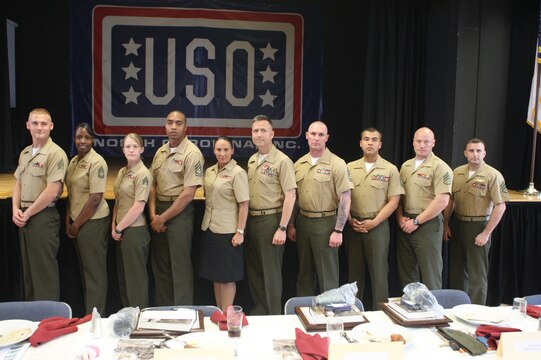 The nine recipients of the Instructor of the Year award along with Col. Timothy Mundy, commanding officer of the School of Infantry, Camp Geiger, at the Jacksonville, N.C. chapter of the United Service Organization, March 25. The awards are given to the best instructor from the nine schools, chosen on how they presented themselves as well as the material they teach.