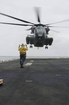 A CH-53E "Super Stallion" with Marine Medium Helicopter Squadron 165 (Reinforced) prepares to land on the USS Peleliu docked at Naval Base San Diego May 17, 2010. HMM-165 (Rein) is preparing to ship out with the 15th Marine Expeditionary Unit on May 20, 2010, to the Western Pacific for a seven-month deployment.