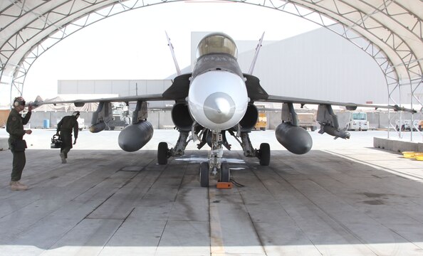 Marines of Marine Fighter Attack Squadron 232, 3rd Marine Aircraft Wing (Forward), prepare an F/A-18D Hornet for flight at Kandahar Air Field.  On Nov. 4, seven F/A-18s such as this one were used in a preplanned precision strike against known insurgent firing points and weapons caches at Kajaki Dam.  Throughout the course of the day, 14,000 pounds of ordnance were dropped on 21 predetermined locations.