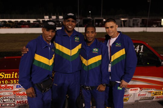 Conseil International du Sport Militaire, (International Military Sports Council) boxers from Brazil pose next to a race car during a CISM cultural day event, Oct. 15. The cultural event gave the Brazilian team, as well as the other countries, the opportunity to learn about each other’s similarities, differences and also experience some of American culture.