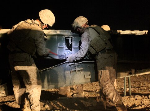 Marines with Bridge Platoon, Company A, 9th Engineer Support Battalion, 1st Marine Logistics Group (Forward), remove an old bridge in order to replace it with a safer, more reliable bridge in Marjah, Afghanistan, Oct. 23. The Marines removed the old medium girder bridge and replaced it with a newer 4-bay double story medium girder bridge, to be used by coalition forces and local nationals.