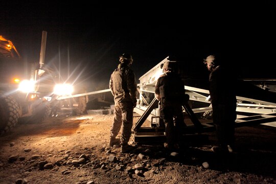 Marines with Bridge Platoon, Company A, 9th Engineer Support Battalion, 1st Marine Logistics Group (Forward) install a 4-bay double story medium girder bridge in Marjah, Afghanistan, Oct. 23. The Marines removed an old medium girder bridge and replaced it with a newer one, to be used by coalition forces and local nationals.
