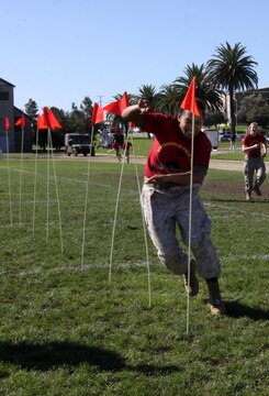 Cpl. Kristal N. Howell, maintenance non-commissioned officer, 9th Communication Battalion, I Marine Expeditionary Force, maneuvers through one of the obstacles during Camp Pendleton’s 2010 Leatherneck Field Meet at the 11 Area field, Oct. 27. The Leatherneck Field Meet is a competition for Marines to compete against other units to build camaraderie and esprit de corps.