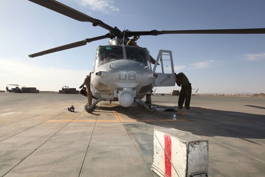 Marines with Marine Light Attack Helicopter Squadron 369, 3rd Marine Aircraft Wing (Forward), prepare a UH-1Y Huey to fill the position of the troops in contact, or TIC, response aircraft. HMLA-369 responds to TIC requests when coalition forces call for immediate aerial support.