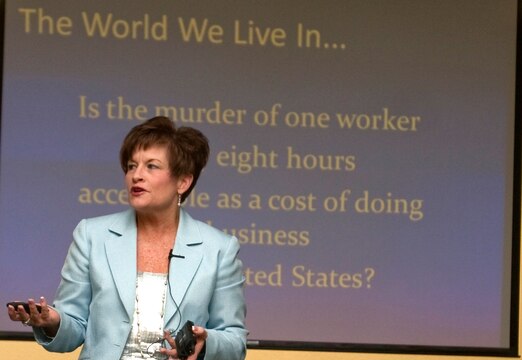 Deborah R. Collins, executive director for the National Security Training Institute, presents her Violence in the Workplace security briefing to dozens of service members and employees assigned to U.S. Marine Corps Forces, Pacific, Sept. 10 at the MarForPac headquarters building, Camp H. M. Smith, Hawaii. Collins uses her firsthand experience as a survivor of the 1988 shooting at Electromagnetic Systems Labs to teach the warning signs and how to handle a potentially violent employee.