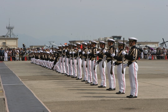 The Japan Maritime Self-Defense Force drill team performs at the JMSDF Iwakuni base festival here Sunday. The JMSDF drill team is composed of cadets in flight training. Other performances included Taiko drums, White Snake Power Rangers and the Japanese band Salbia.
