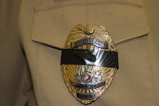 Marine Corps Recruit Depot San Diego’s law enforcement officers recently banded together to mourn a fallen comrade. As a sign of honor and respect, MCRD’s law enforcement placed a black mourning band around the center of their badges for Officer Jeremy Henwood of the San Diego Police Department.