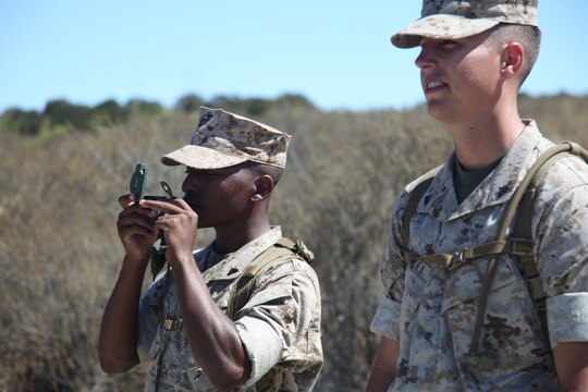 Marines attending Combat Logistics Regiment 17 Corporals’ Course check their azimuth during a land navigation class at Camp Pendleton, Calif., Aug. 17. The corporals attending the course learned basic leadership skills needed to lead the Marines under their charge. They also learned close-order drill, small-unit leadership, Marine Corps common skills, sword manual and other Marine Corps knowledge.