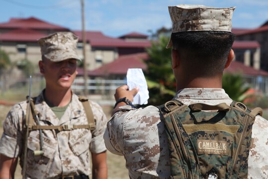 A Marine with 1st Marine Logistics Group checks his drill card during the close-order drill portion of the Combat Logistics Regiment 17 Corporals Course at Camp Pendleton, Calif., Aug. 17. The corporals attending the course learned basic leadership skills needed to lead the Marines under their charge. They also learned small-unit leadership, Marine Corps common skills, sword manual and other Marine Corps knowledge.