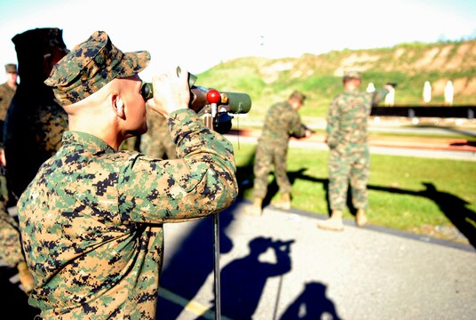 Sgt. Christopher Sanchez, drill instructor, checks out his target using a range spotting scope during the annual Depot Competition in Arms. The event, which lasts from Jan. 31 until Feb. 12, is held at Edson Range, Weapons Field Training Battalion, Camp Pendleton, Calif. The contest draws Marines from throughout the depot and the Western Recruiting Region.