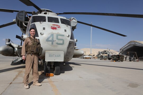 Navy Lt. Sarah Ballard stands aside a CH-53D Sea Stallion with the Marine Heavy Helicopter Squadron 362 “Ugly Angels,” 3rd Marine Aircraft Wing (Forward), at Camp Bastion, Afghanistan, Jan. 17. Ballard, the squadron’s flight surgeon who recently received the Richard Luehrs Memorial Award as the operational flight surgeon of the year, often volunteers to fly during combat missions as an aerial observer and on-call casualty evacuation doctor.