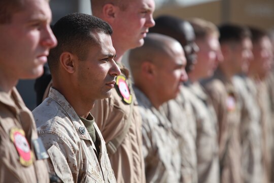 Marines from the Aircraft Rescue and Firefighting section of Marine Wing Support Squadron 373, 3rd Marine Aircraft Wing (Forward), await their letters of appreciation during an awards ceremony aboard Camp Bastion, Afghanistan, Jan. 25.  U.K. firefighters and ARFF Marines received these awards for their superior service while working in a joint environment aboard Camp Bastion.