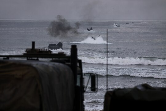 Amphibious Assault Vehicles splash into the shoreline of Camp Pendleton’s Red Beach as part of a training exercise, July 26. More than 550 Marines from 4th Assault Amphibian Battalion reserve unit came to base as part of their annual training exercises to practice amphibious assault tactics.