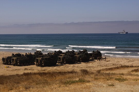 The marine layer floats heavily over Camp Pendleton’s Red Beach horizon as Amphibious Assault Vehicles prepare to splash into the ocean to practice amphibious assault tactics, July 26. More than 550 Marines from 4th Assault Amphibian Battalion reserve unit came to base as part of their annual training exercises.