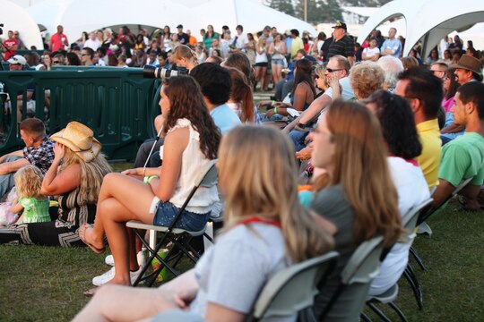 Hundreds of Marines, sailors and Onslow county residents gather to watch Marine Corps Community Services' Show Us Watcha Got competition aboard Marine Corps Base Camp Lejeune, May 21. The first-place prize was a $1,000 check awarded to winner, Valerie Morales.