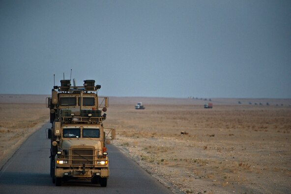 A U.S. Air Force M915 Tractor from the 70th medium truck detachment leads a convoy through Iraq with a load of equipment and supplies on Oct. 30, 2011. With less than five miles left before crossing the Iraqi border, the convoy of 43 vehicles traveled 1,100 miles in seven days hauling equipment out of the country as part of an effort to meet the deadline for the U.S. Military to transition out of Iraq . (U.S. Air Force Photo/Master Sgt. Jeffrey Allen)