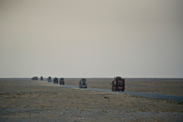 A U.S. Air Force Airmen from the 70th medium truck detachment lead a convoy through Iraq with a load of equipment and supplies on Oct. 30, 2011. With less than five miles left before crossing the Iraqi border, the convoy of 43 vehicles traveled 1,100 miles in 7 days hauling equipment out of the country as part of an effort to meet the deadline for the U.S. Military to transition out of Iraq . (U.S. Air Force Photo/Master Sgt. Jeffrey Allen)