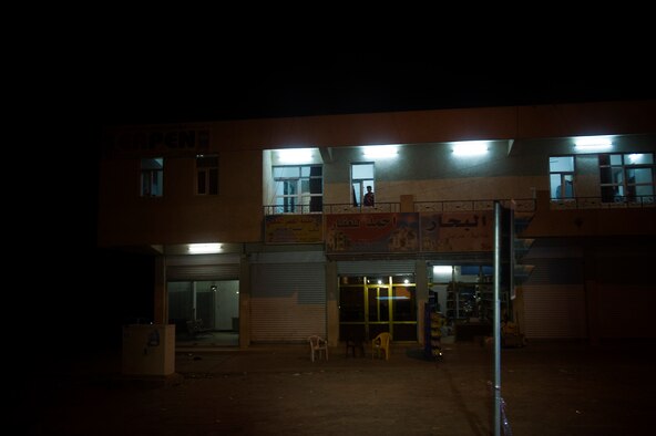 U.S. Army mine-resistant ambush protected caiman vehicle, operated by the Minnesota Army National Guard's B-Troop, 1-94 Cavalry, Pine City MN., provides armed escort for a convoy as Iraqis watch from windows while driving through Tikrit, Iraq on Oct. 27, 2011. B-Troop is providing security for a convoy of 43 vehicles tasked with hauling equipment and supplies out of Iraq. (U.S. Air Force Photo/Master Sgt. Jeffrey Allen)