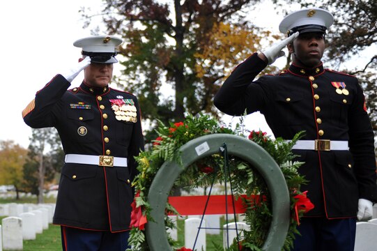 Sgt. Maj. Micheal P. Barret, sergeant major of the Marine Corps, and Lance Cpl. Dusten Reevs, Marine Corps body bearer from Marine Barracks Washington, salute the grave of Sgt. Maj. Herbert Sweet, fourth sergeant major of the Marine Corps, at Arlington National Cemetery Nov. 10. Six teams from the Barracks, including Barrett and the assistant commandant of the Marine Corps, visited various graves of former commandants and sergeants major of the Marine Corps in the National Capital Region to honor those former leaders of the Corps for the Marine Corps birthday.::r::::n::