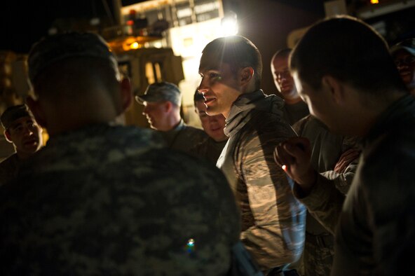 U.S. Air Force Tech. Sgt. David Perez, convoy commander, 70th medium truck detachment and Santa Fe, NM. native, briefs his team before departing on the final segment of a seven day convoy mission transporting equipment out of Iraq on Oct. 22, 2011. Perez is responsible for leading a convoy of 43 vehicles and 60 passengers more than 1,100 miles through Iraq. Members of the 70th MTD are hauling equipment out of Iraq to meet the deadline for the U.S. military transition from Iraq. (U.S. Air Force Photo/Master Sgt. Jeffrey Allen)
