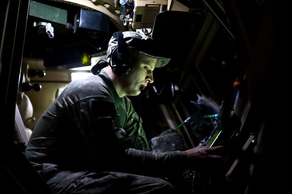 U.S. Army Sgt. Steven Barsness, a truck commander assigned to Minnesota Army National Guard's B-Troop, 1-94 Cavalry, Pine City MN., and Sandstone, MN. native, programs the convoys route into a mine-resistant ambush protected caiman vehicle at Kalsu, Iraq on Oct. 29, 2011. B-Troop is providing security for a convoy of 43 vehicles tasked with hauling equipment and supplies out of Iraq. (U.S. Air Force Photo/Master Sgt. Jeffrey Allen)