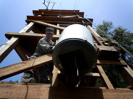 Staff Sgt. Daniel Robinson, 368th Expeditionary Air Support Operations Group weather techinician, lowers a piece of equipment for repair at Bagram Airfield, Afghanistan. Robinson is deployed from Hurlburt Field, Fla., and is from West Palm Beach, Fla. (Courtesy Photo)