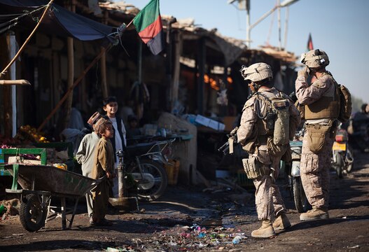Cpl. Daniel Botero, a combat engineer with the Combat Logistics Battalion 1 Embedded Partnering Team, 2nd Marine Logistics Group (Forward), shows his surgical scar, Nov. 16, aboard Camp Leatherneck, Afghanistan.  He received the scar from a surgery in 2009 during his testicular cancer treatment, which is now in remission.  (U.S. Marine Corps photo by Cpl. Katherine M. Solano)