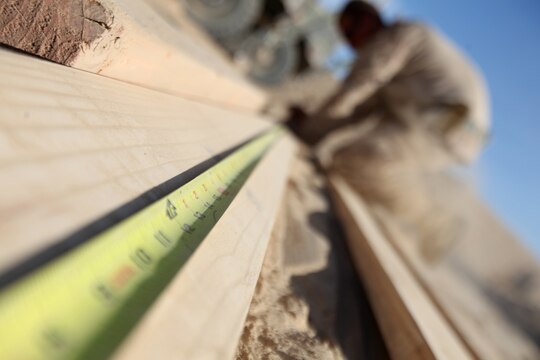 Cpl. Mathew Alsup, of Eugene, Ore., measures a section of lumber during the construction of Patrol Base New Jersey, Afghanistan, Nov. 23. Alsup is a motor transportation operator with Combat Logistics Company 6, 2nd Marine Logistics Group (Forward). The CLC, which is comprised of two engineer platoons and one motor transportation platoon, is an element of Combat Logistics Battalion 6 and was formed to provide direct support to 1st Battalion, 6th Marine Regiment, during Operation Eastern Storm. CLC engineers built several of the patrol bases along Route 611. (U.S. Marine Corps photo by Sgt. Justin J. Shemanski)
