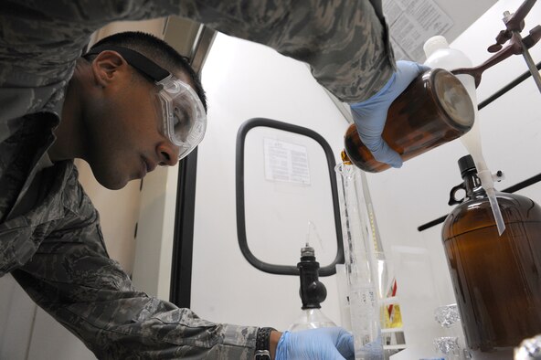 Staff Sgt. Abel Telles, the NCO in charge of the fuels laboratory for the petroleum, oil and lubricants flight in the 380th Expeditionary Logistics Readiness Squadron, pours a fuel sample into a graduated cylinder during a fuel system icing inhibitor test, Sept. 30, 2011, at an air base in Southwest Asia. The test is used to make sure the fuel has all the proper additives required to meet military standards. Telles is a native of Santa Maria, Calif. and is deployed from Luke Air Force Base, Ariz.  (U.S. Air Force photo/Master Sgt. Chance Babin)