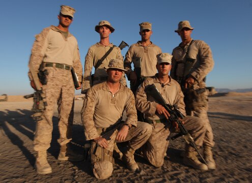 (Clockwise from back row, left) Sgt. John Paul Rodriguez, Cpl. Joshua Kelley, Cpl. Joshua Keeton, Sgt. Thomas Bolander, Cpl. Ryan Kaethow and Lance Cpl. Adam Roos pause for a photograph moments after returning to Forward Operating Base Nolay, Afghanistan, Oct. 16. Ohio natives Keeton, Bolander, Kaethow and Roos are Marine Corps reservists who have spent the last three months shoulder-to-shoulder supporting combat operations in Helmand province. All Marines currently serve with Combat Logistics Company, Combat Logistics Battalion 6 - an element of 2nd  Marine Logistics Group (Forward). (U.S. Marine Corps photo by Sgt. Justin J. Shemanski)