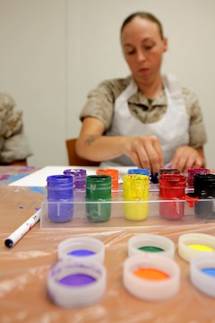 Cpl. Amber Weeks paints a canvas during a Art 4 Healing class at Camp Pendleton's Behavioral and Deployment Health center, Oct. 17. The program is designed to support emotional healing through are and creative expression for those living with pain, grief, fear or stress.